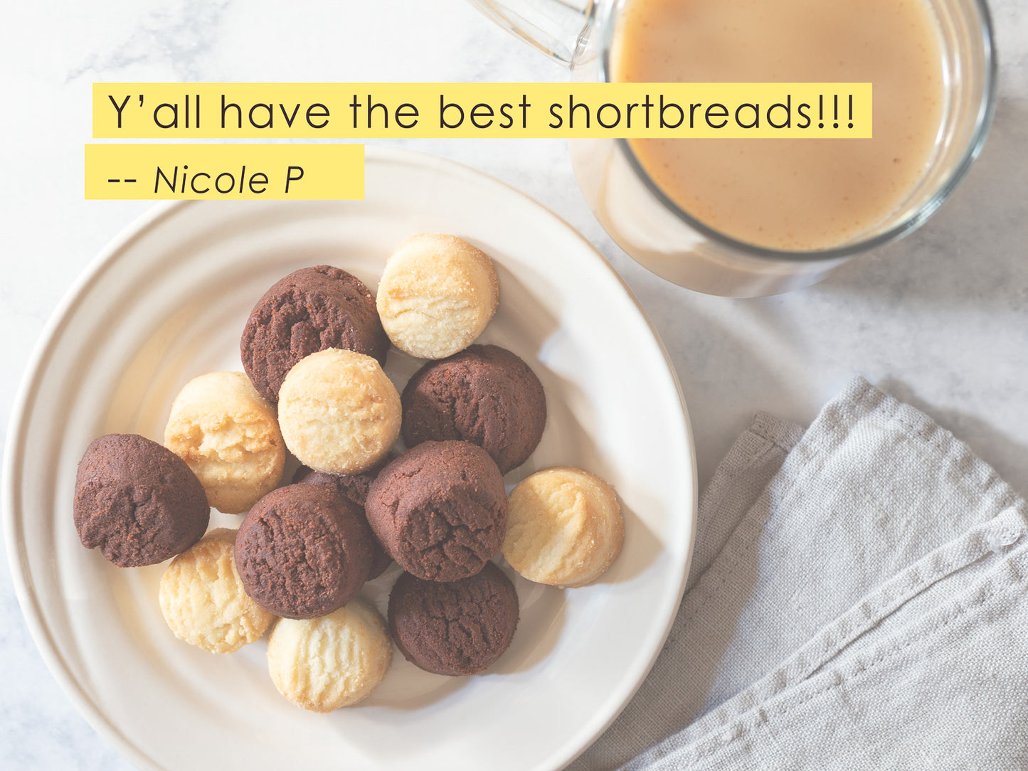 classic and chocolate shortbread beside a cup to coffee on a table