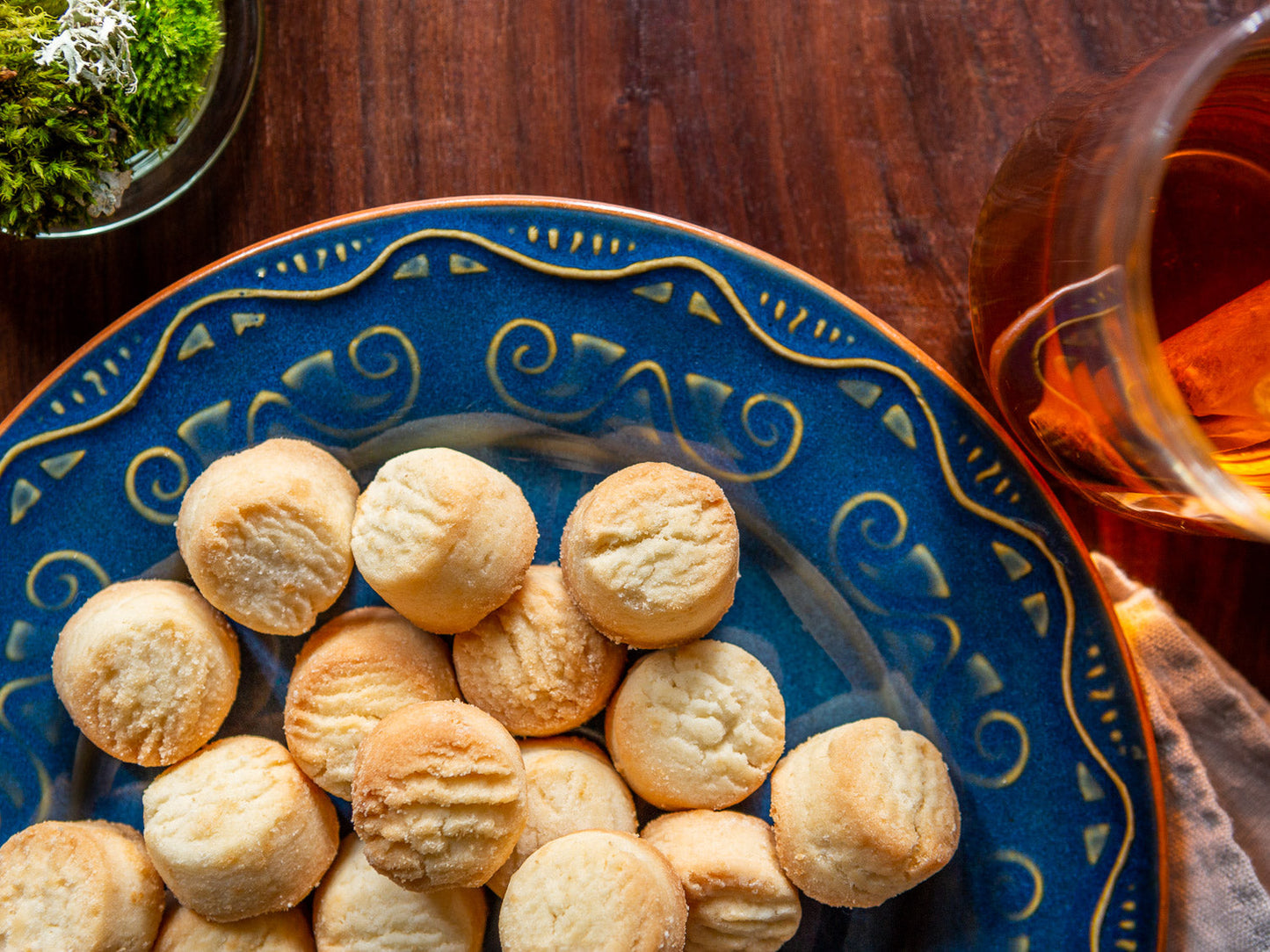 colorful plate with classic shortbread shorties and a cup of tea