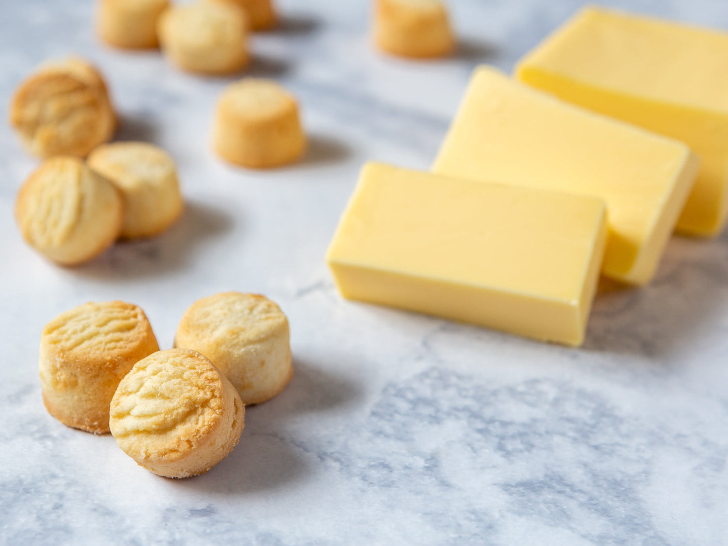shortbread shorties shown with fresh butter on marble countertop