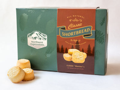 an elegant gift box shown with a few classic shortbread cookies